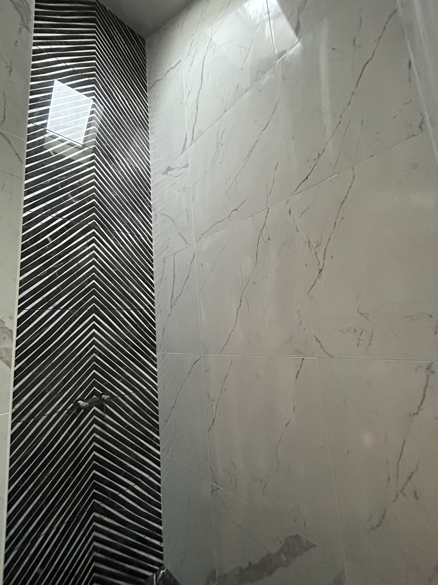 Chevron tile detail shower wall