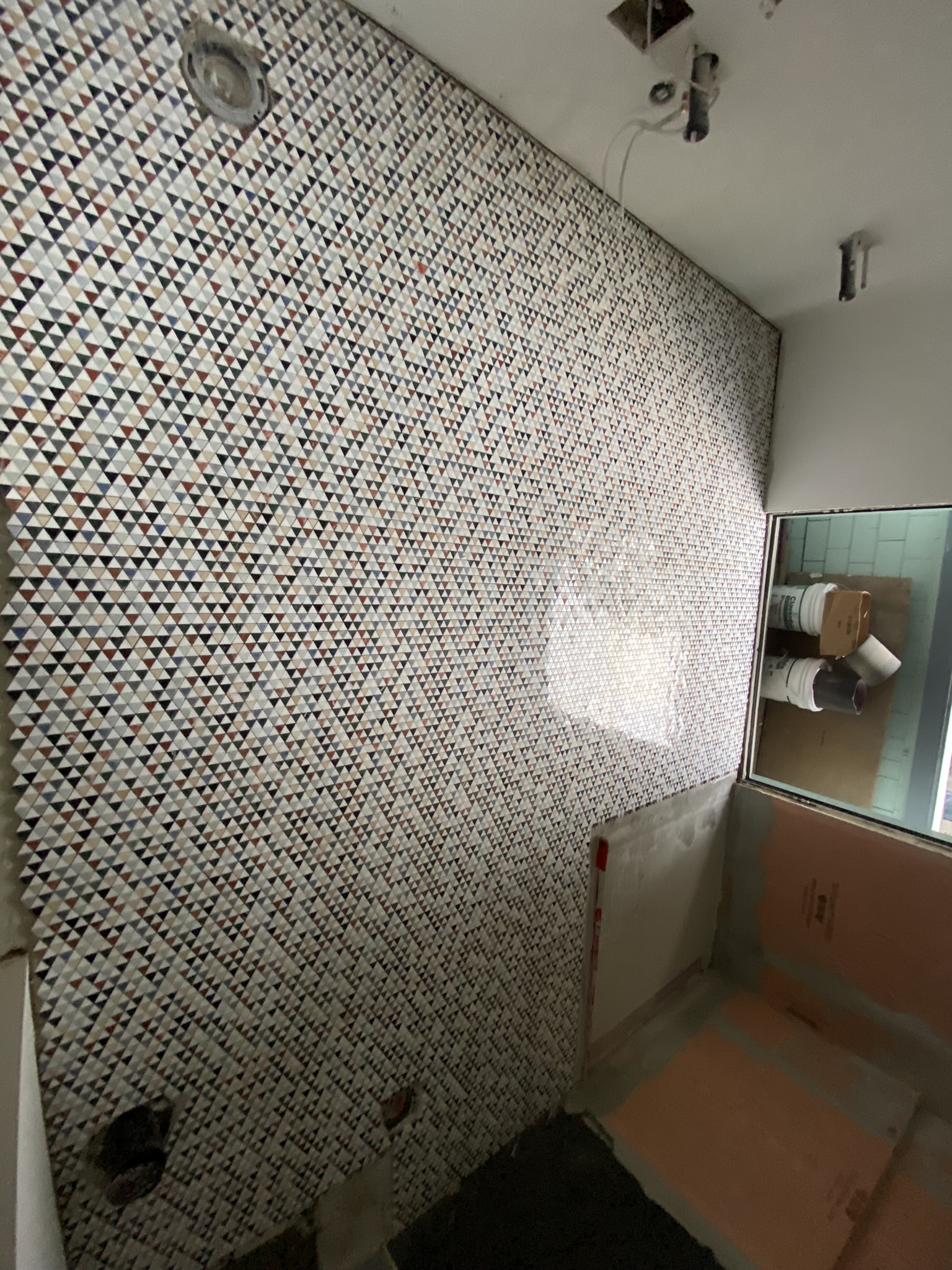 Colourful triangle mosaic feature wall