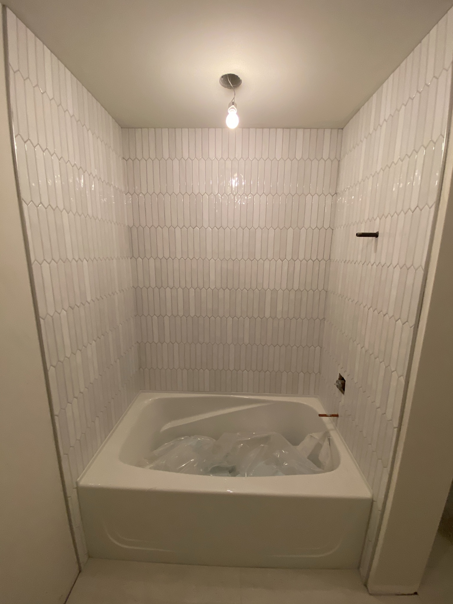 White picket tile bathroom floor view