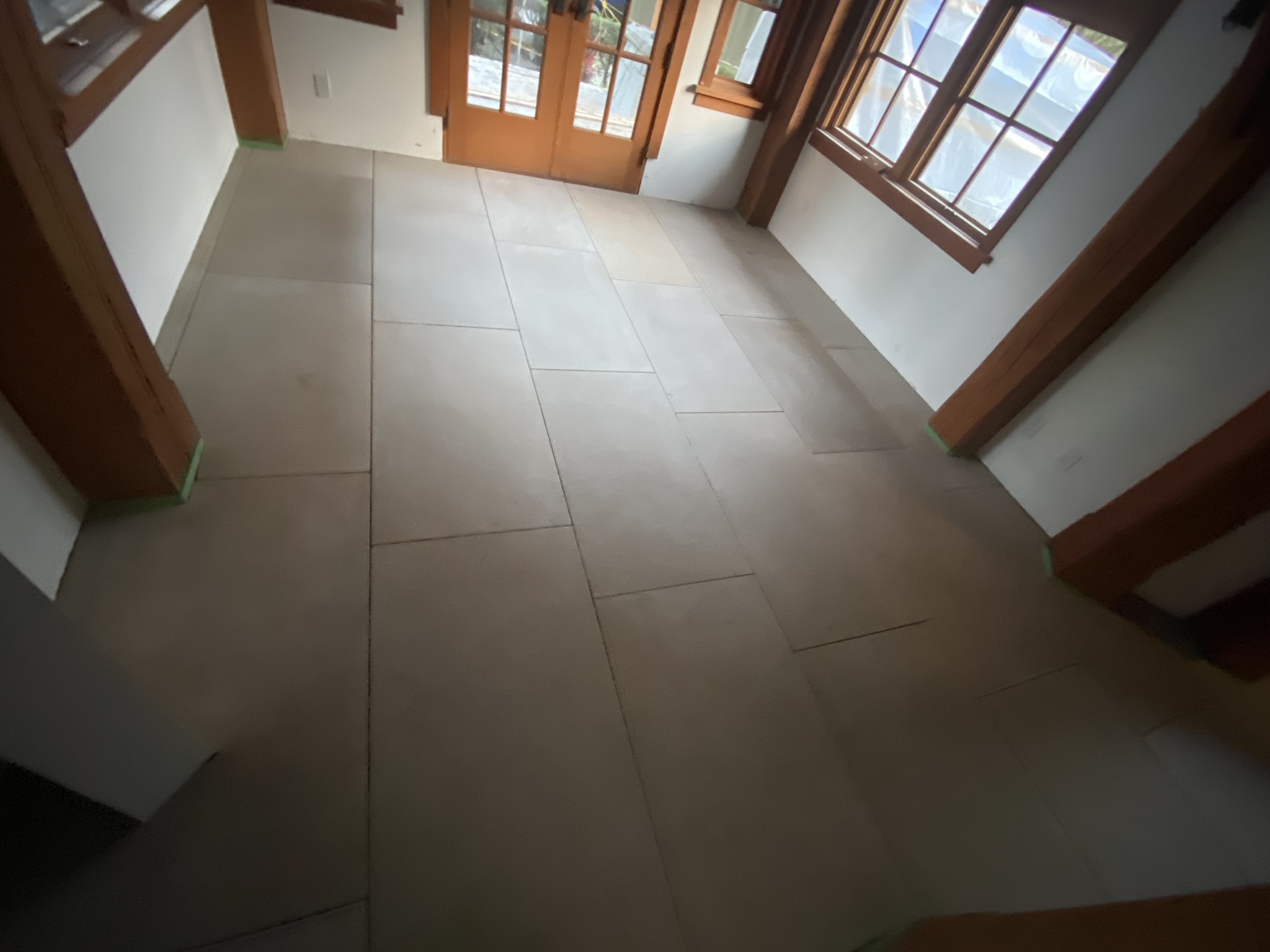 Dark marble shower with glass enclosure