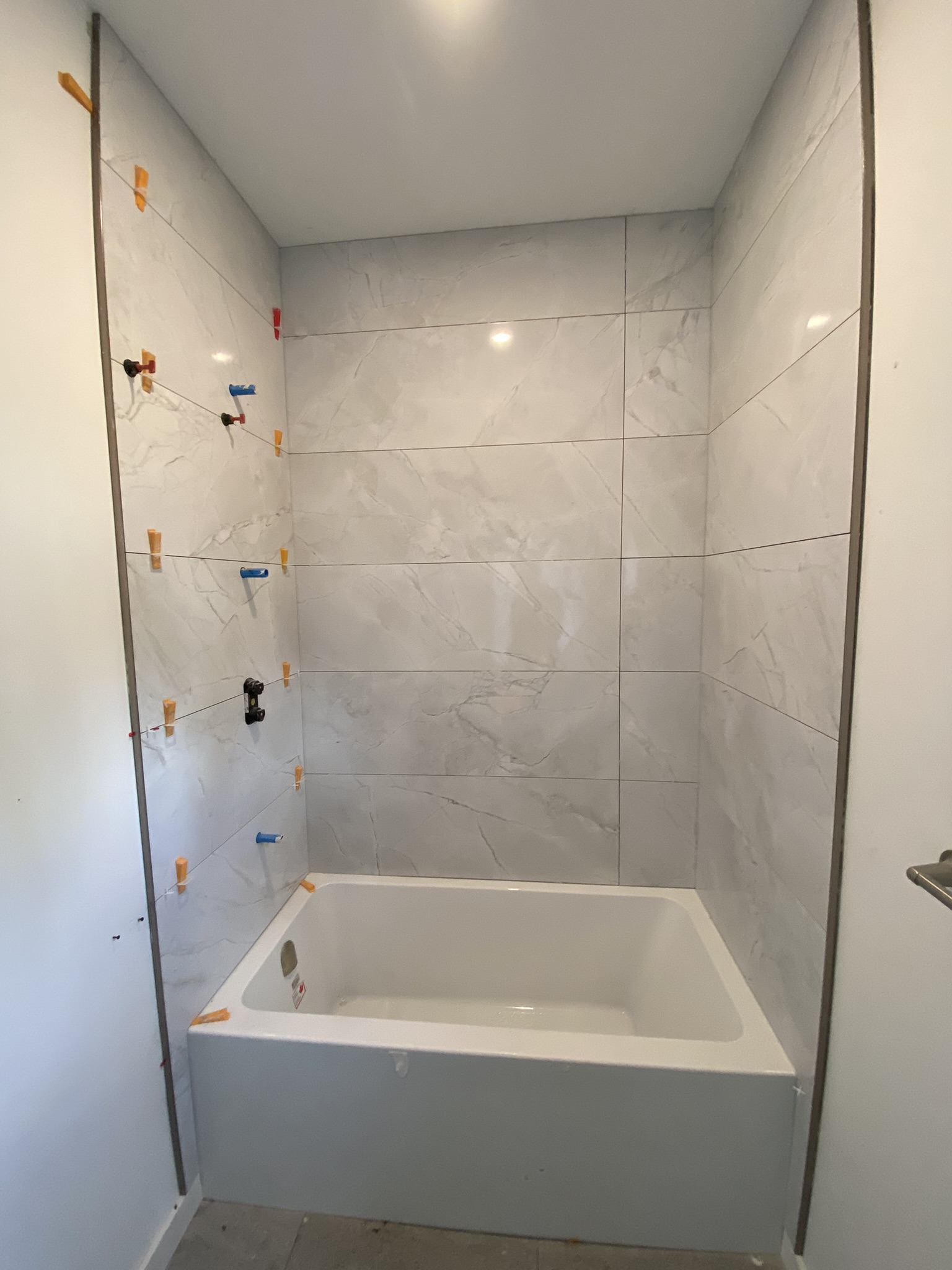 White zellige mosaic shower