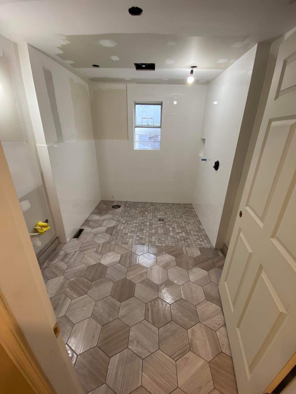 Full marble master bathroom with soaker tub