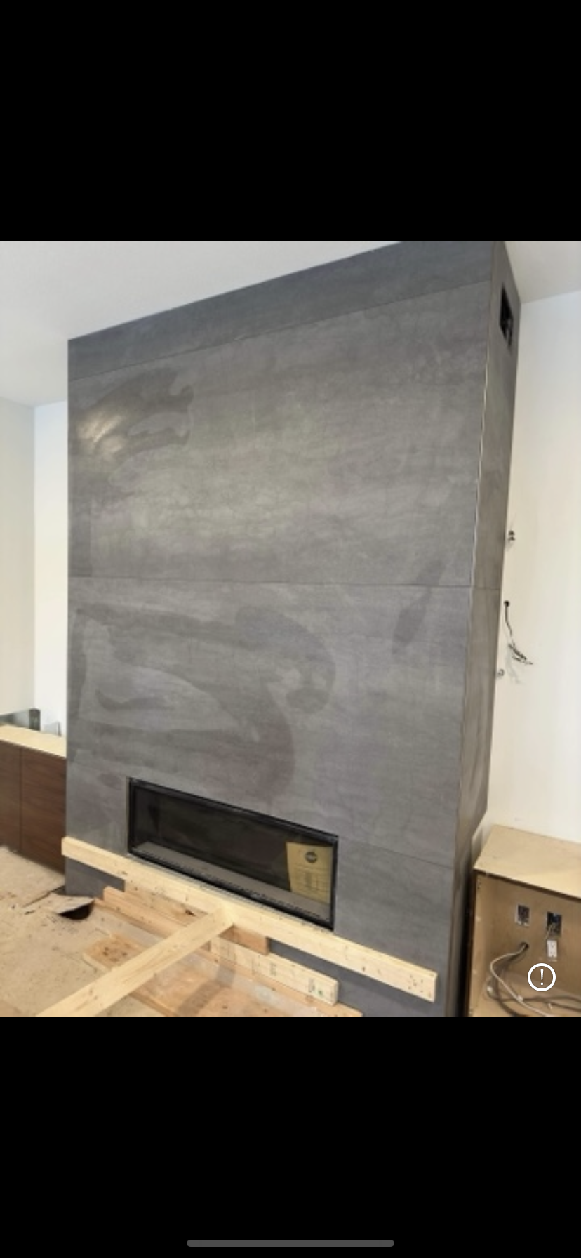 Large format grey concrete fireplace surround