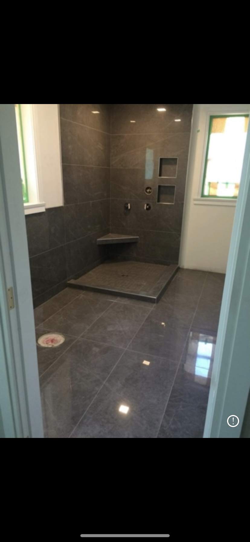 Dark stone tile bathroom with walk-in shower