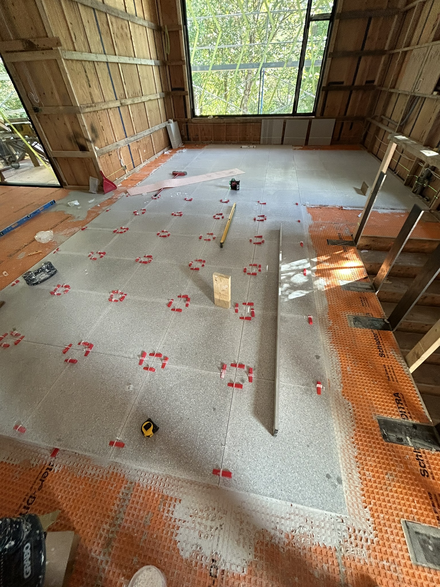 Large format tile floor vaulted ceiling home