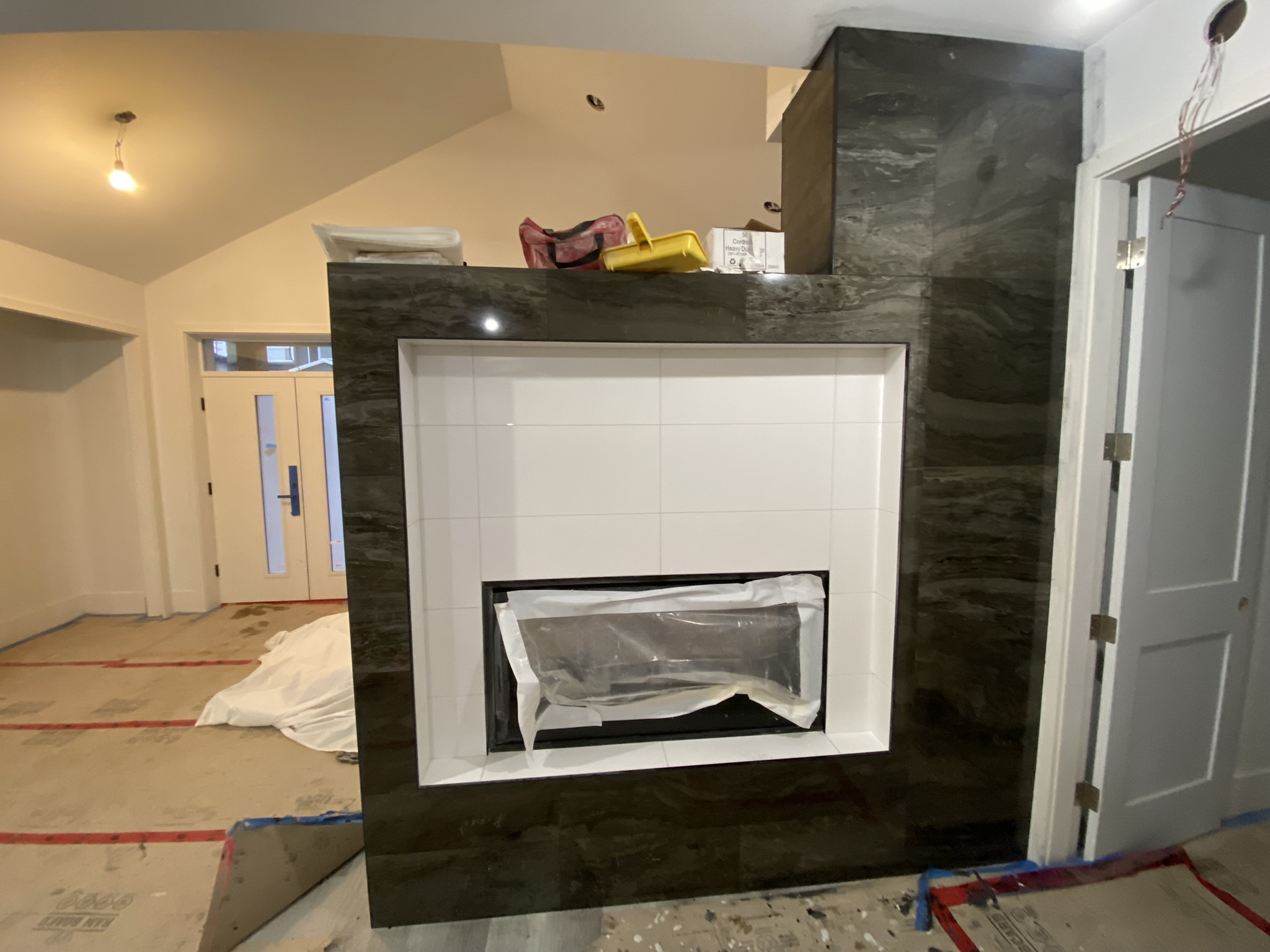 Dark marble fireplace with white interior surround