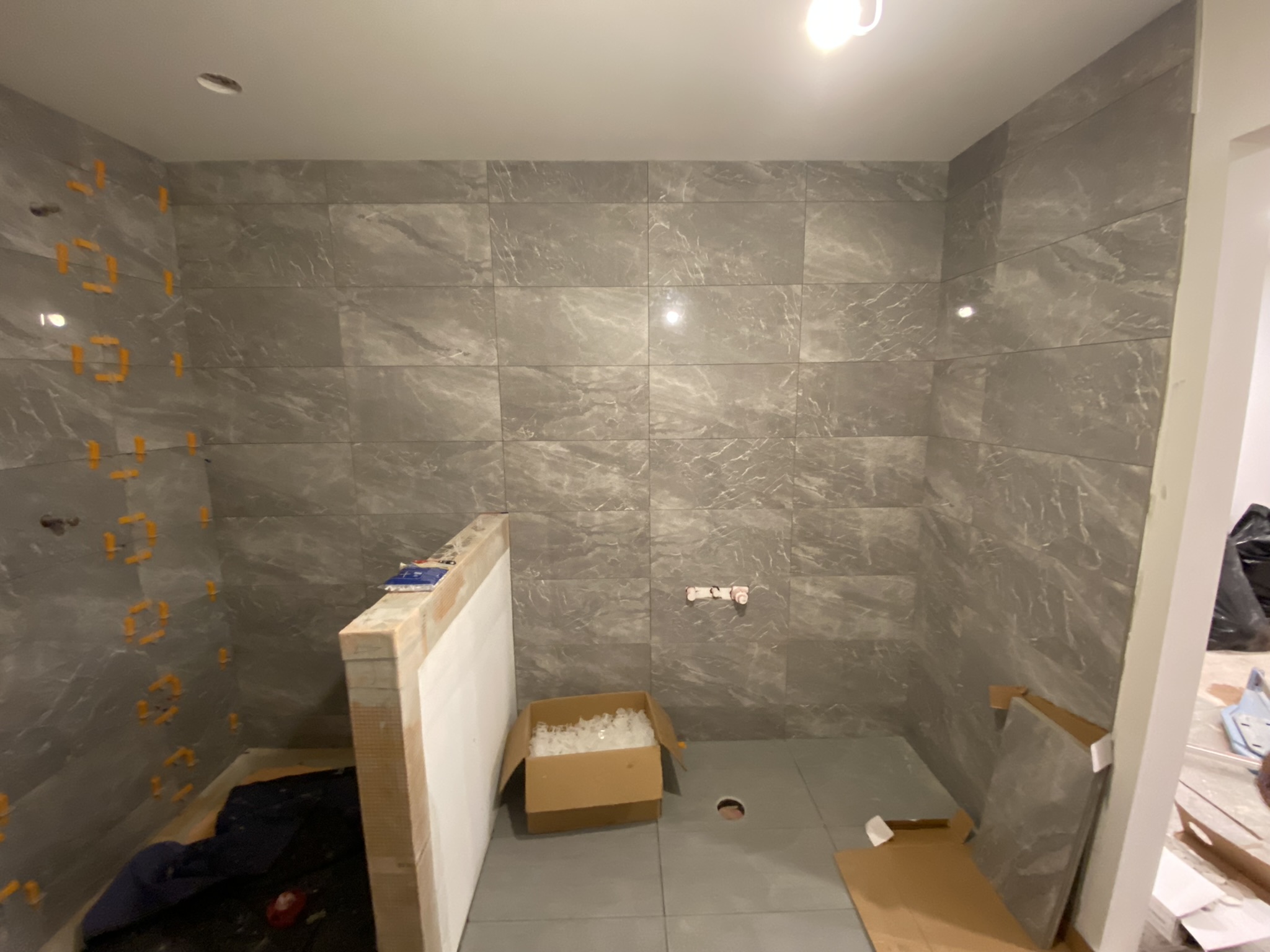 Grey marble large format shower walls