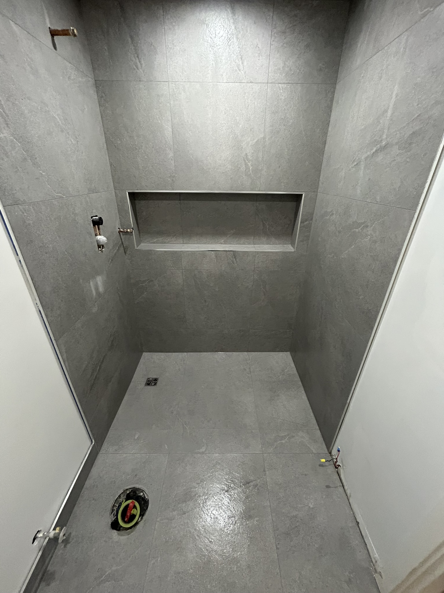 Grey stone shower with built-in niche