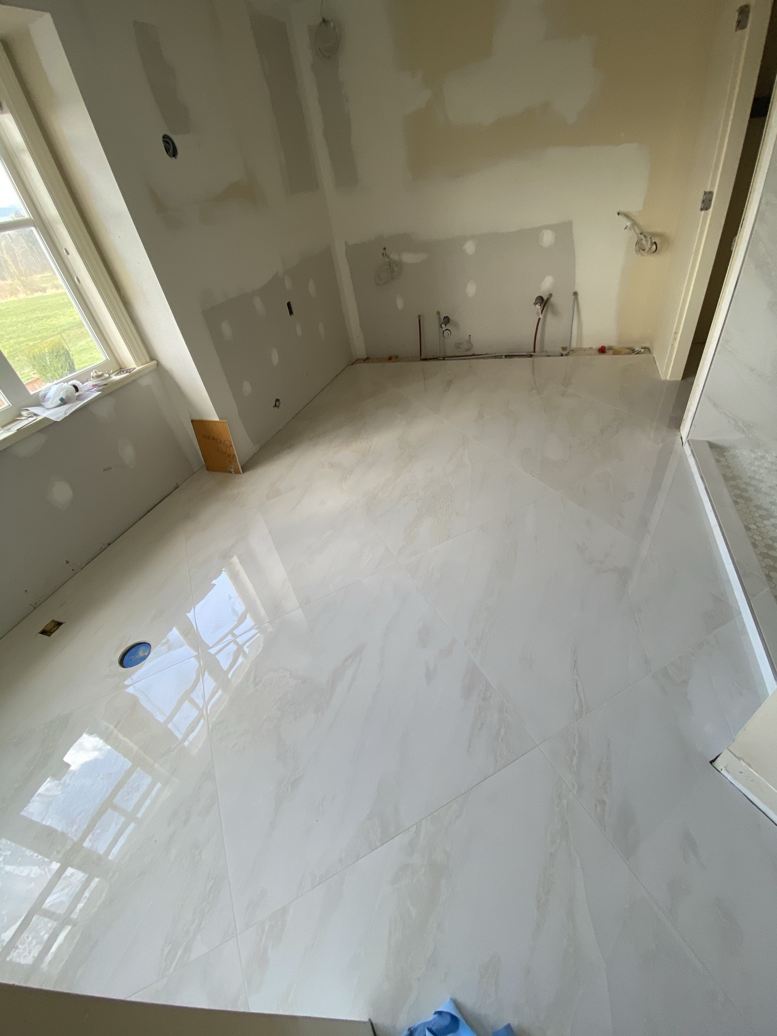 White marble large format bathroom floor